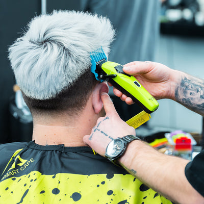 Colored magnetic guide guards for clippers, 0.5 to 4 mm, used on men's haircuts for precise styling.